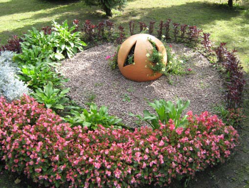 Jardín de flores de bricolaje en el país: opciones de diseño, fotos, esquemas de plantación
